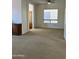 Living room with neutral carpet, window with shade, and a ceiling fan at 7143 E Canyon Wren Dr, Gold Canyon, AZ 85118