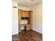 Bright home office with custom cabinetry and desk space and laminate flooring at 7143 E Canyon Wren Dr, Gold Canyon, AZ 85118