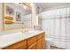 Clean bathroom with wood cabinets and nautical decor at 7341 E Sutton Dr, Scottsdale, AZ 85260