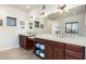 Double vanity bathroom with a large mirror and plenty of counter space at 7341 E Sutton Dr, Scottsdale, AZ 85260