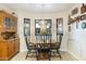 Charming breakfast nook with a wood table and four chairs, adjacent to kitchen at 7341 E Sutton Dr, Scottsdale, AZ 85260