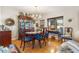 Formal dining room with hardwood floors, a wood table, and a china cabinet at 7341 E Sutton Dr, Scottsdale, AZ 85260