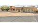 Home's exterior with a driveway and a view of the two-car garage with barn doors at 7341 E Sutton Dr, Scottsdale, AZ 85260