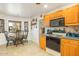 Kitchen with oak cabinets, stainless steel appliances, and a built in microwave at 7341 E Sutton Dr, Scottsdale, AZ 85260