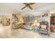 Living room with a gallery wall, comfy seating, and view into kitchen at 7341 E Sutton Dr, Scottsdale, AZ 85260