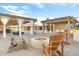 Large backyard with fire pit and two wooden chairs at 7341 E Sutton Dr, Scottsdale, AZ 85260