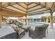 Relaxing covered patio with seating area overlooking the pool at 7341 E Sutton Dr, Scottsdale, AZ 85260