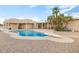 Charming backyard oasis with a kidney-shaped pool and diving board at 7341 E Sutton Dr, Scottsdale, AZ 85260