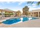 Stunning kidney shaped pool and spacious patio with pergola at 7341 E Sutton Dr, Scottsdale, AZ 85260