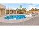 Beautiful kidney shaped pool with a large patio and lounge chairs at 7341 E Sutton Dr, Scottsdale, AZ 85260