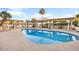 Inviting kidney shaped pool with multiple covered seating areas at 7341 E Sutton Dr, Scottsdale, AZ 85260