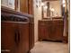 Elegant bathroom with ornate wooden vanity at 8540 E Mcdowell Rd # 121, Mesa, AZ 85207