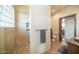 Bathroom with walk-in shower, tile flooring, and a window at 8540 E Mcdowell Rd # 121, Mesa, AZ 85207