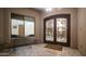 Elegant entryway with double stained-glass doors and a small sitting area at 8540 E Mcdowell Rd # 121, Mesa, AZ 85207