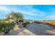 Landscaped front yard with a brick pathway leading to the house entrance at 8540 E Mcdowell Rd # 121, Mesa, AZ 85207