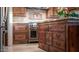 Island kitchen with rich wood cabinets and granite at 8540 E Mcdowell Rd # 121, Mesa, AZ 85207