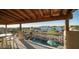 Covered patio overlooking the pool and surrounding landscape at 8540 E Mcdowell Rd # 121, Mesa, AZ 85207