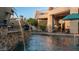 Relaxing pool area with fountain and patio furniture at 8540 E Mcdowell Rd # 121, Mesa, AZ 85207