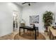 Bright home office features wood floors and built-in shelving at 1583 S 155Th St, Gilbert, AZ 85296