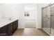 Bathroom featuring tile floors, white countertop and walk-in shower at 17703 W Southgate Ave, Goodyear, AZ 85338