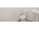 Bathroom featuring a white toilet and sink with new fixtures and updated vanity at 17703 W Southgate Ave, Goodyear, AZ 85338