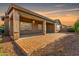 Wide-angle of an exterior covered patio with brick pavers and sunset views at 20856 E Arroyo Verde Dr, Queen Creek, AZ 85142