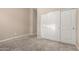 Neutral bedroom features plush carpeting and a closet with sliding doors at 20856 E Arroyo Verde Dr, Queen Creek, AZ 85142