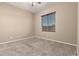 Carpeted bedroom featuring a window with blinds, a ceiling fan, and neutral walls at 20856 E Arroyo Verde Dr, Queen Creek, AZ 85142