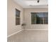 Bright, neutral bedroom with tile flooring, a ceiling fan, and multiple windows for great natural light at 20856 E Arroyo Verde Dr, Queen Creek, AZ 85142