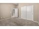 Neutral bedroom features plush carpeting and a closet with sliding doors at 20856 E Arroyo Verde Dr, Queen Creek, AZ 85142