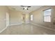 Bright bedroom features tile flooring, neutral paint, and natural light at 20856 E Arroyo Verde Dr, Queen Creek, AZ 85142