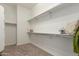 A walk-in closet with shelving, carpeted flooring, and storage space at 20856 E Arroyo Verde Dr, Queen Creek, AZ 85142