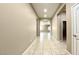 Hallway with tiled flooring leading to the living room at 20856 E Arroyo Verde Dr, Queen Creek, AZ 85142
