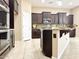 Bright kitchen features granite countertops, custom cabinets, and stainless steel appliances at 20856 E Arroyo Verde Dr, Queen Creek, AZ 85142