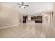 Open-concept kitchen seamlessly connected to the living area, with an island and stainless steel appliances at 20856 E Arroyo Verde Dr, Queen Creek, AZ 85142