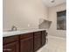 Functional laundry area offers cabinet storage and a utility sink at 20856 E Arroyo Verde Dr, Queen Creek, AZ 85142