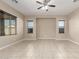 Open living room featuring neutral walls, tiled flooring, ceiling fan and window blinds at 20856 E Arroyo Verde Dr, Queen Creek, AZ 85142