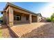 Back patio featuring a brick walkway, a covered patio, and landscaping at 20856 E Arroyo Verde Dr, Queen Creek, AZ 85142