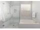 Clean bathroom with walk-in shower and soaking tub at 32427 N 71St Way, Scottsdale, AZ 85266