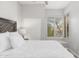 Bright bedroom with a queen bed and window seat at 32427 N 71St Way, Scottsdale, AZ 85266