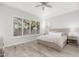 Spacious bedroom with light wood floors and large windows at 32427 N 71St Way, Scottsdale, AZ 85266