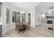 Kitchen dining area with table and chairs and access to backyard patio at 32427 N 71St Way, Scottsdale, AZ 85266