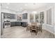 Bright dining area with wooden table and chairs, adjacent to kitchen at 32427 N 71St Way, Scottsdale, AZ 85266