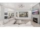 Spacious living room featuring hardwood floors, fireplace, and large window at 32427 N 71St Way, Scottsdale, AZ 85266