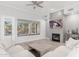 Living area with hardwood floors, fireplace, and large window with backyard view at 32427 N 71St Way, Scottsdale, AZ 85266