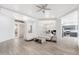 Bright living room with hardwood floors, comfy seating, and a view to the kitchen at 32427 N 71St Way, Scottsdale, AZ 85266