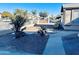 Front yard view of the property, showing landscaping and walkway at 6931 W Crittenden Ln, Phoenix, AZ 85033