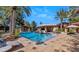 Resort-style pool and patio with lounge chairs and umbrellas at 8306 N Merion Way, Paradise Valley, AZ 85253