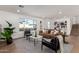 Well-lit living room with modern furniture, large window and contemporary decor at 8531 E San Miguel Ave, Scottsdale, AZ 85250