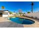 Backyard pool features travertine tile border and easy access ladder at 8531 E San Miguel Ave, Scottsdale, AZ 85250